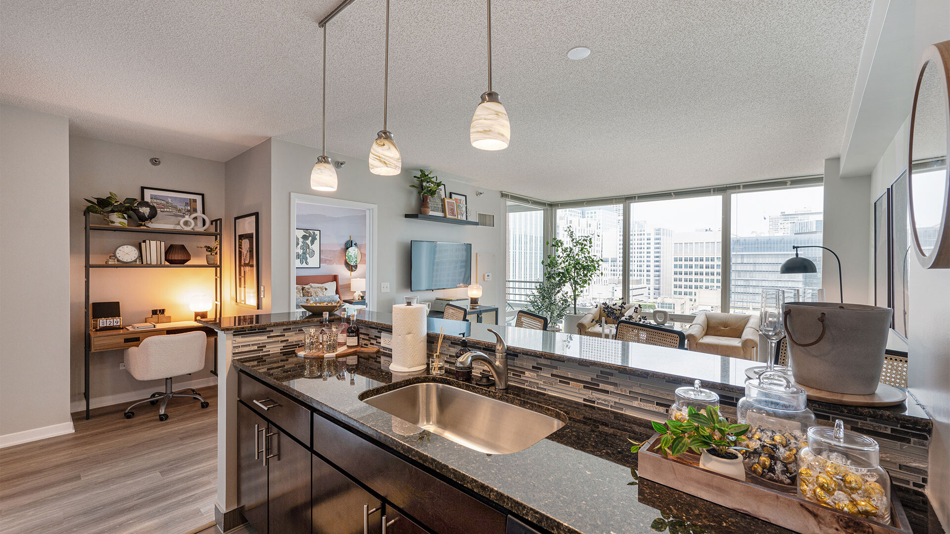 Kitchen peninsula and living room with office nook